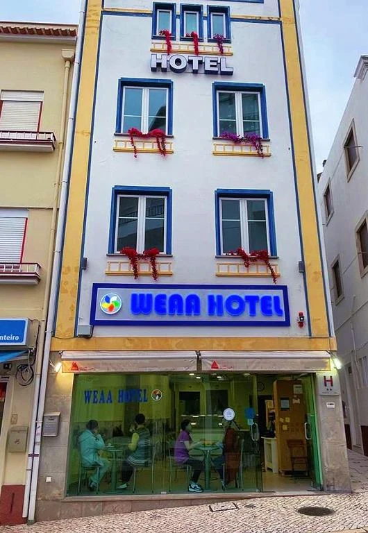 The WEAA Hotel façade on a central Nazaré street